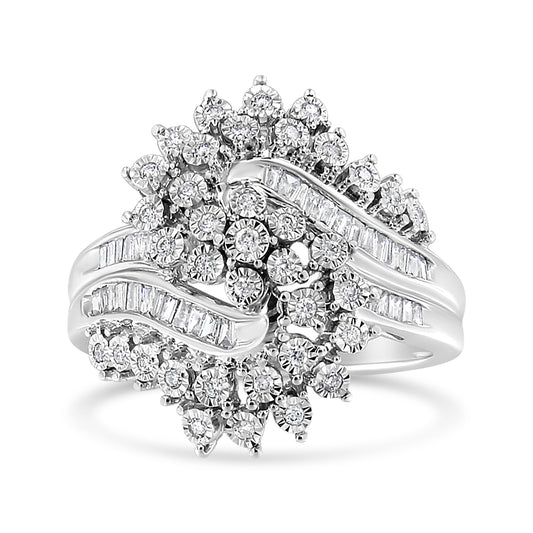White metal ring with round and baguette white gemstones in miracle and channel settings, shown at a slight front angle.