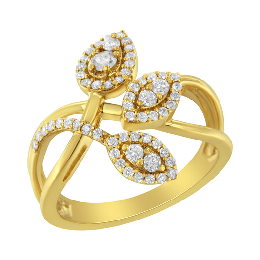 Yellow metal ring with an open, split shank design featuring three leaf-shaped clusters of round white gemstones in prong settings, shown in a close-up angled view.