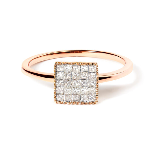 Close-up front angle of a rose metal ring featuring a square cluster of white princess-shaped gemstones set invisibly.