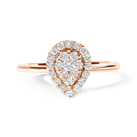 Front view of a rose metal ring with a pear-shaped cluster of round white gemstones in prong settings.
