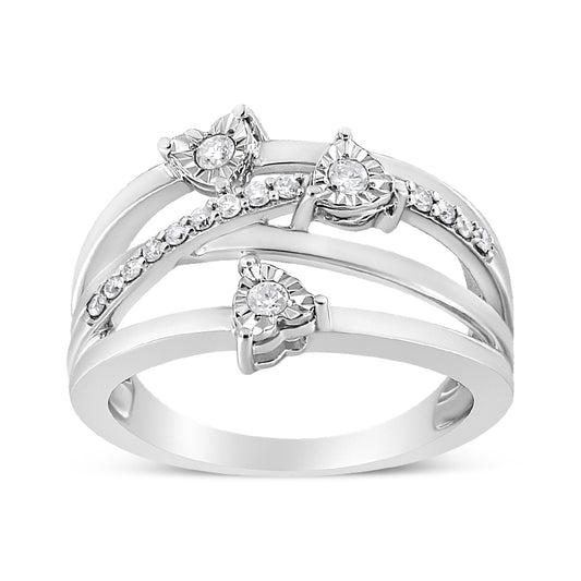 White metal ring with three round white gemstones in a miracle setting and a row of round white gemstones in a prong setting, shown from a front angle.