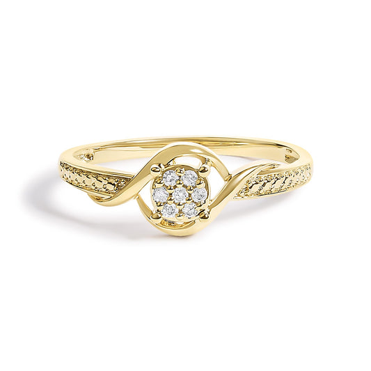 Close-up frontal view of a yellow metal ring with a central cluster of round white gemstones in prong setting, featuring an intricate twisted band design with additional small white gemstones along the sides.