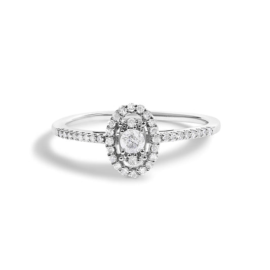 White metal ring with an oval cluster of multiple round white gemstones at the center and a band adorned with additional round white gemstones, shown in a front-facing close-up angle on a white background.