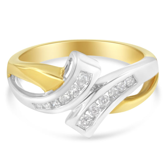 Close-up front angle of a two-toned ring featuring intertwined bands with channel-set round white gemstones.
