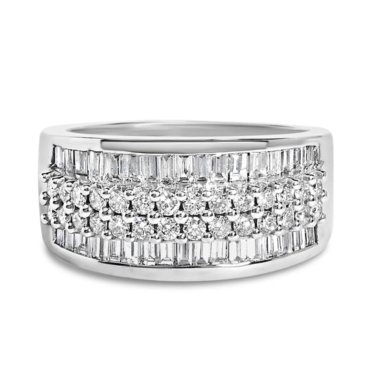 White metal ring with three rows of white round gemstones in prong settings on top and a middle row of white baguette gemstones in channel setting, shown at an angled close-up.