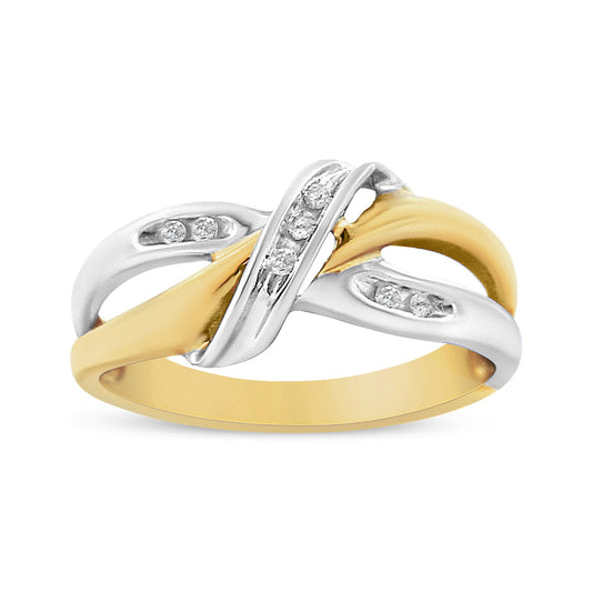 Two-toned ring with intertwined metal bands accented by white round gemstones in channel settings, shown in a front angled view.