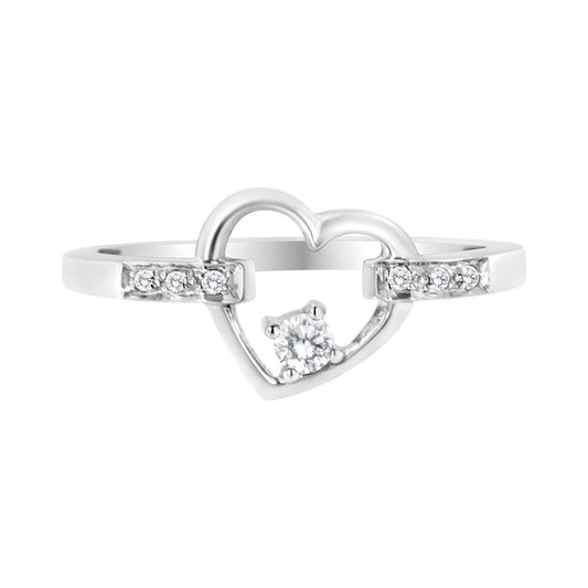 White metal ring with open heart shape featuring a round white gemstone in a four-prong setting at the center and additional small white gemstones embedded on either side, shown in a front-facing angle.