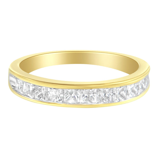 Yellow metal ring with channel-set princess-shaped white gemstones, shown in a close-up front angle.