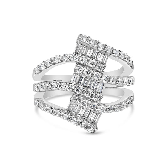 Close-up front angle view of a white metal ring featuring multiple bands adorned with white round gemstones in prong setting and white baguette gemstones in channel setting.