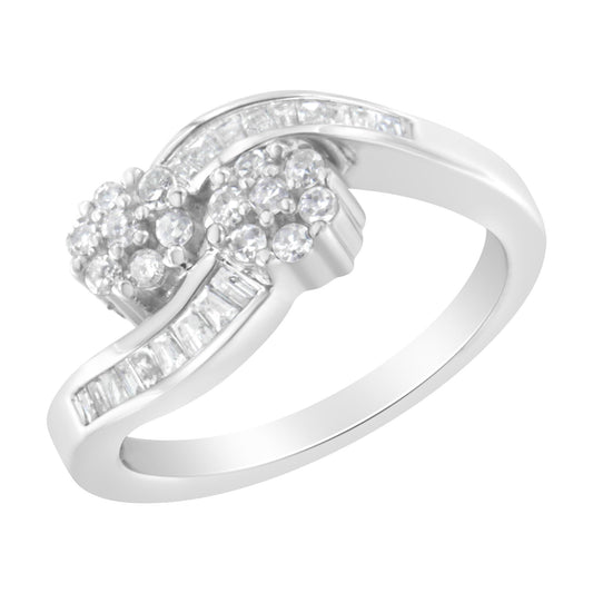 White ring with round and baguette-shaped white gemstones in prong and channel settings, shown at an angled close-up.
