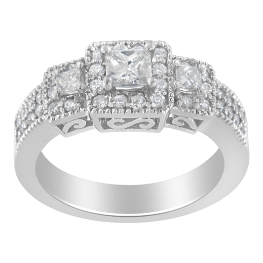 White metal ring with a three-stone setting featuring princess-shaped and round white gemstones, viewed from the front angle.