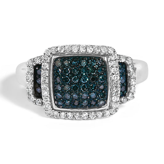 Top-front angle view of a white metal ring featuring a large square cluster of blue gemstones surrounded by pavé-set white gemstones, with additional blue and white gemstone clusters on the shoulders.