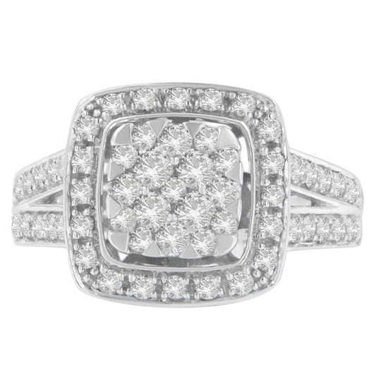 Front-facing view of a white metal ring featuring a cluster of round white gemstones in pave setting at the center, surrounded by two halos of smaller round white gemstones, with additional gemstones set along the split band.