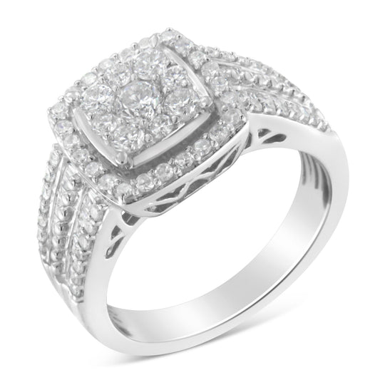 White metal ring with a square cluster of round white gemstones in prong settings at the center, surrounded by a double halo of smaller round white gemstones, with additional rows of round and baguette white gemstones along the split shank, shown at a slight angle.