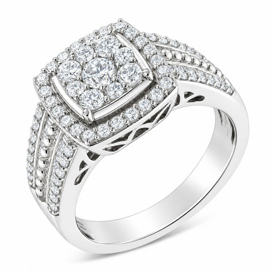 Close-up angled view of a white metal ring featuring a square-shaped cluster of round white gemstones in prong settings with smaller round white gemstones surrounding it. The band displays rows of small round white gemstones along with a row of small round metal bead accents and channel-set baguette-shaped white gemstones.