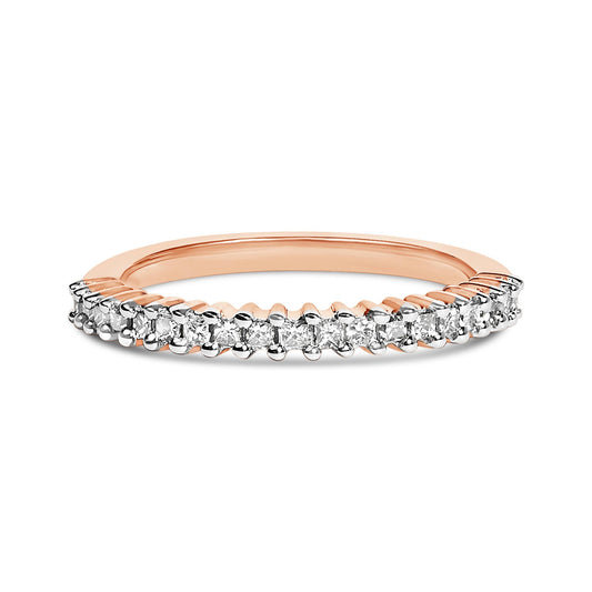 Close-up front angle of a rose-colored ring featuring a row of princess-shaped white gemstones set in prongs along the top half.