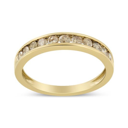 Yellow metal ring with brownish round gemstones in a channel setting, shown in a front angle view.