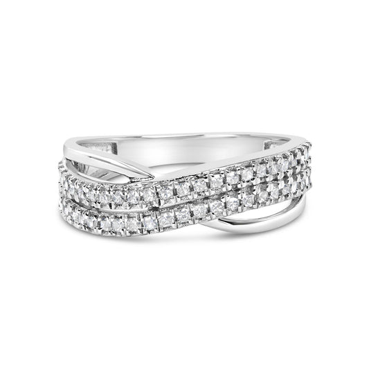 Close-up angled view of a white metal ring featuring multiple rows of princess-shaped white gemstones in prong settings, with a crisscross design element.