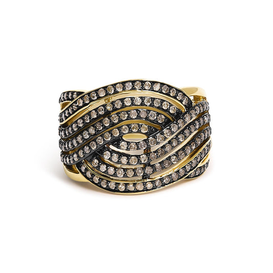 Close-up front angle of a yellow metal ring featuring multiple intertwined bands adorned with round champagne-colored gemstones in prong settings.