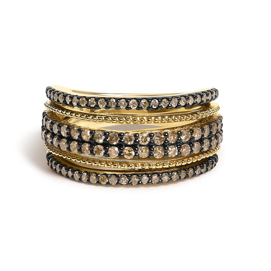 Close-up angled view of a yellow metal ring featuring multiple rows of round champagne-colored gemstones in prong settings, alternating with smooth beaded bands.