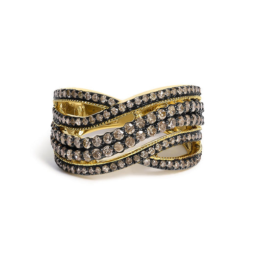 Close-up front angle of a yellow metal ring with intertwined bands adorned with multiple rows of round champagne-colored gemstones in prong settings.