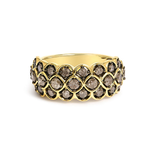 Close-up front angle of a yellow metal ring featuring two rows of round champagne-colored gemstones in prong settings, arranged in a scalloped design.