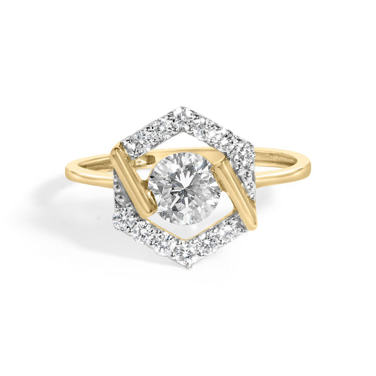 Close-up front view of a yellow ring with a central round white gemstone set with prongs, surrounded by a hexagonal frame of smaller white gemstones in prong settings.