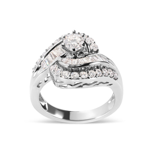 White metal ring with round and baguette white gemstones in prong and channel settings, shown in a front angled view.