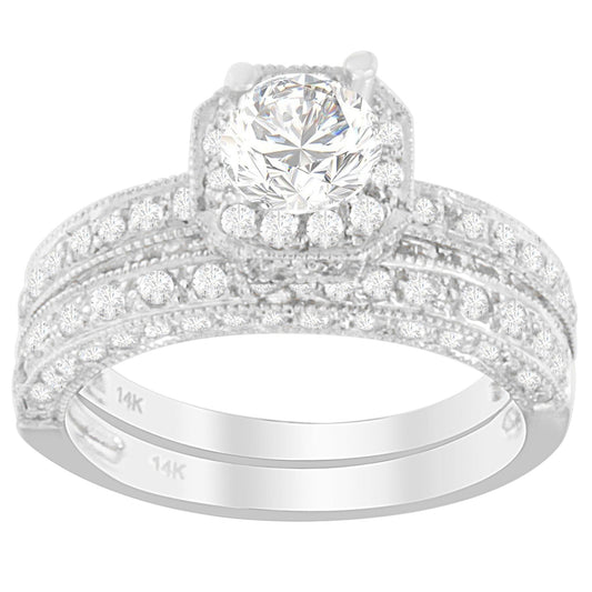 Close-up front angle of a white metal ring set featuring a large round white gemstone in the center surrounded by smaller white gemstones in pave setting on the band.