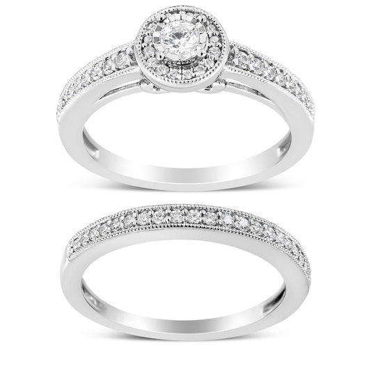 Two white rings with round white gemstones, one with a central raised stone and surrounding smaller stones, the other with a single row of small stones, shown from the front angle.