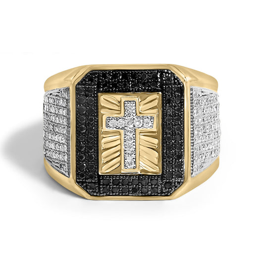 Front view close-up of a yellow ring with a rectangular top featuring a cross design outlined with white gemstones, surrounded by black gemstones, and white gemstones on the bands.