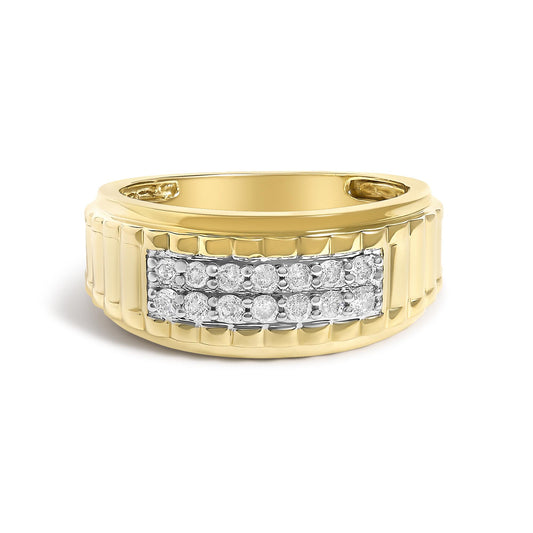 Close-up front view of a yellow metal ring with a rectangular section featuring multiple round white gemstones in prong settings.