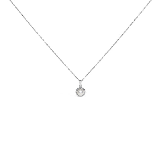 Front-facing close-up of a white metal necklace with a round pendant featuring a central white gemstone surrounded by small white gemstones in a pave setting.