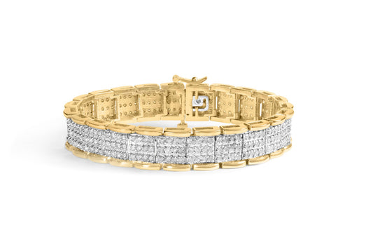 Yellow bracelet with rows of prong-set white round gemstones, shown from a side angle.