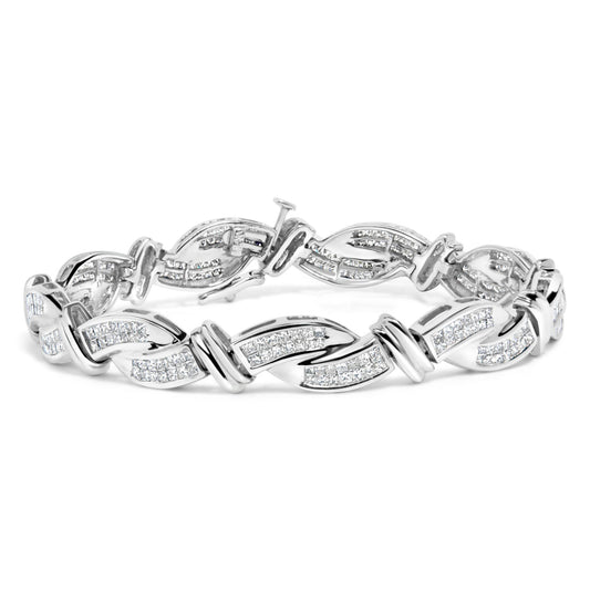 Close-up angle of a white metal bracelet with princess-shaped white gemstones set invisibly in a twisted link design.