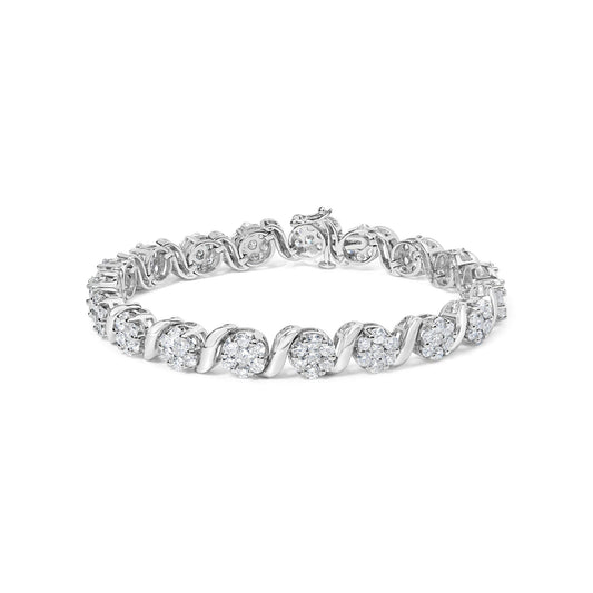 White metal bracelet with clusters of round white gemstones in prong settings, shown at a slight angle on a white background.