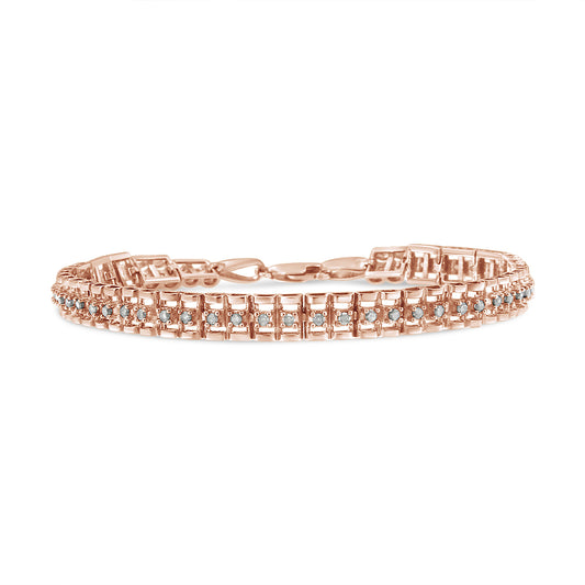 Rose metal bracelet with round white gemstones in prong settings, shown in a front-facing close-up angle.
