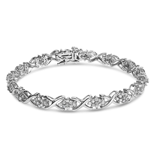 White metal bracelet with round white gemstones in prong settings arranged in a repeating pattern, shown from a slight front angle.