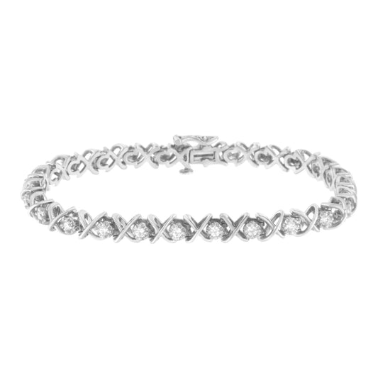 White metal bracelet with round white gemstones in prong settings forming a continuous pattern, shown at a slight angle on a white background.