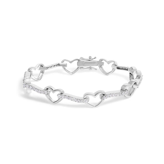 White metal bracelet with heart-shaped links and sections adorned with round white gemstones in prong setting, shown in a top-down angle.