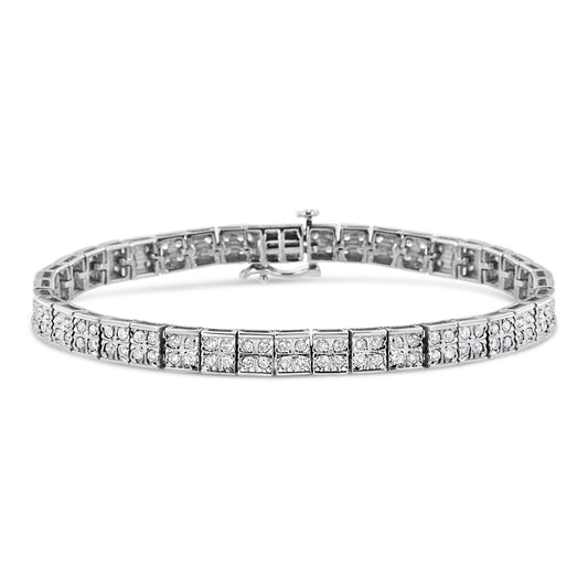 Front-facing close-up of a white metal bracelet with multiple rows of round white gemstones in prong settings.