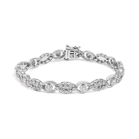 White metal bracelet with alternating oval and circular links set with round white gemstones in prong settings, shown flat on a white background from a front angle.