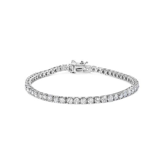 Close-up front view of a white metal bracelet featuring round white gemstones in prong settings, laid flat with the clasp visible.