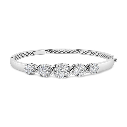 White metal bracelet with five clusters of round white gemstones in prong settings, shown from a front angle.