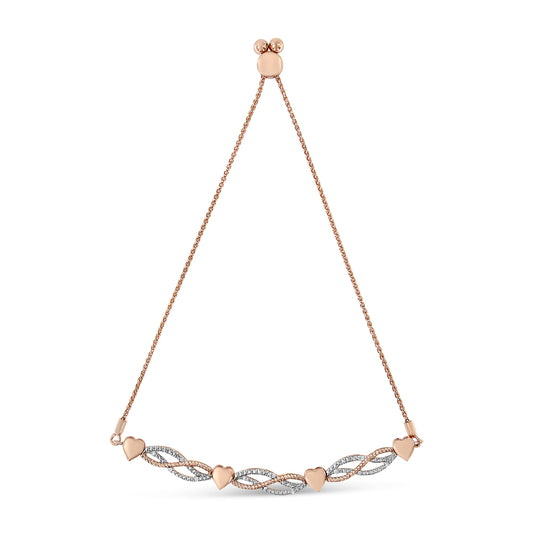 Rose metal bracelet with intertwined twisted design featuring alternating rose metal hearts and rows of white gemstones in pave setting, shown flat against white background from a front angle.