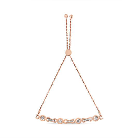 Rose metal bracelet with alternating round white gemstones in two different settings, shown from a front angle.