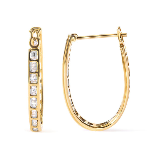 Pair of yellow metal earrings with white round and baguette gemstones, shown from front and side angles.