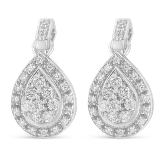Front view of white metal drop earrings with round white gemstones in prong settings arranged in a teardrop shape.
