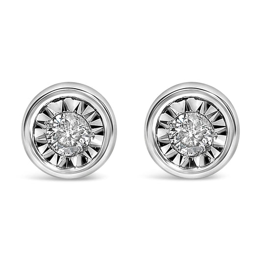 Pair of white metal stud earrings with round white gemstones in miracle settings, shown in a close-up angled view.