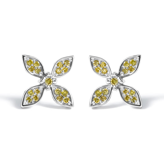 Pair of white metal earrings shaped like four-petal flowers, each petal set with multiple small yellow gemstones and a single yellow gemstone at the center, shown at a front-facing angle on a white background.